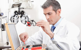 Optometrist Holding Measuring Eye Glasses